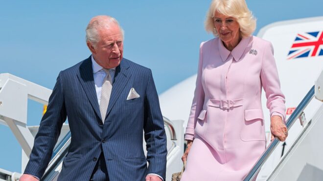 King Charles III and Queen Camilla disembark their plane as they arrive on day one of their State Visit to the United States in April 2026