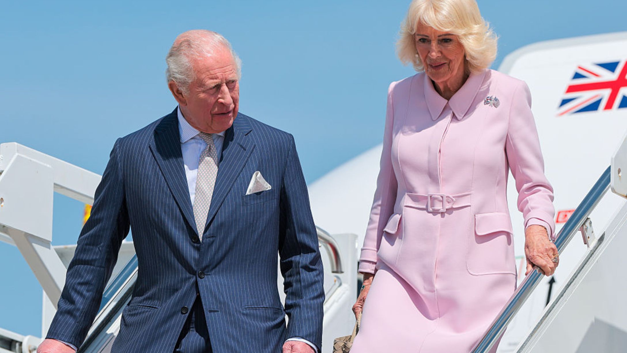 King Charles III and Queen Camilla disembark their plane as they arrive on day one of their State Visit to the United States in April 2026