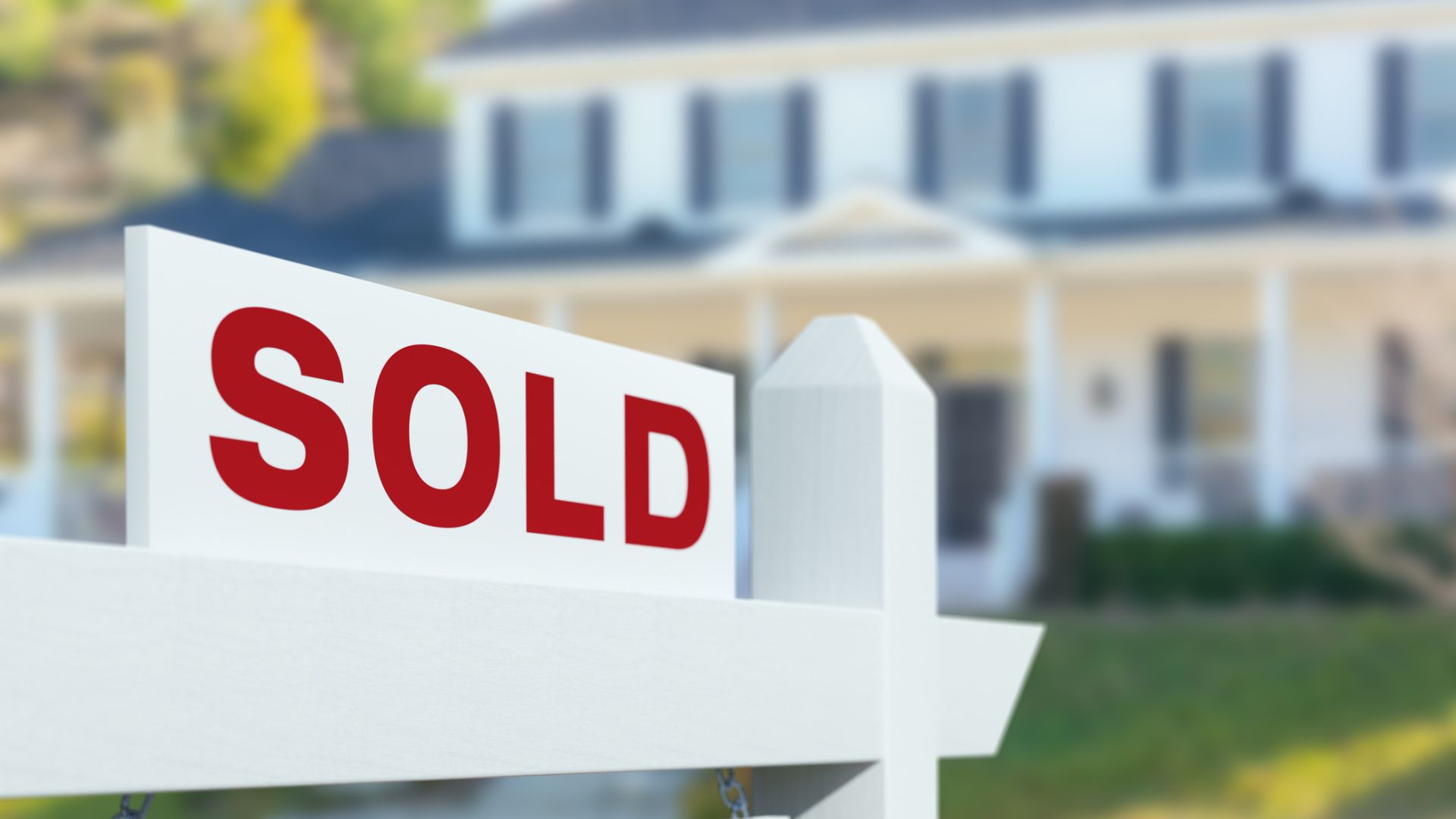 Sold For Sale Real Estate Sign in Front of New House