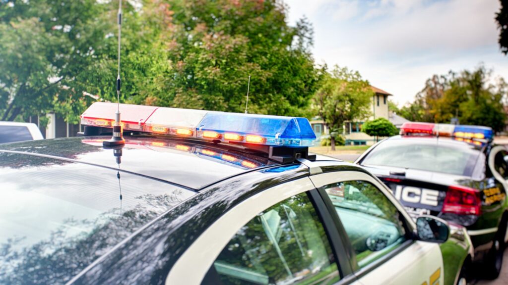 Two police cars pulled over in a residential area