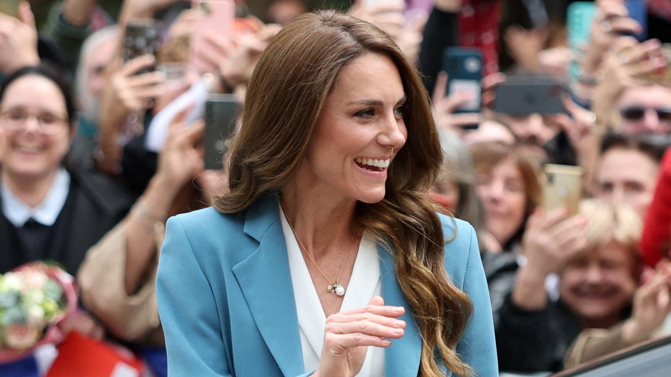 Catherine, Princess of Wales, gestures as she arrives at the city hall on the first day of her visit to Reggio Emilia