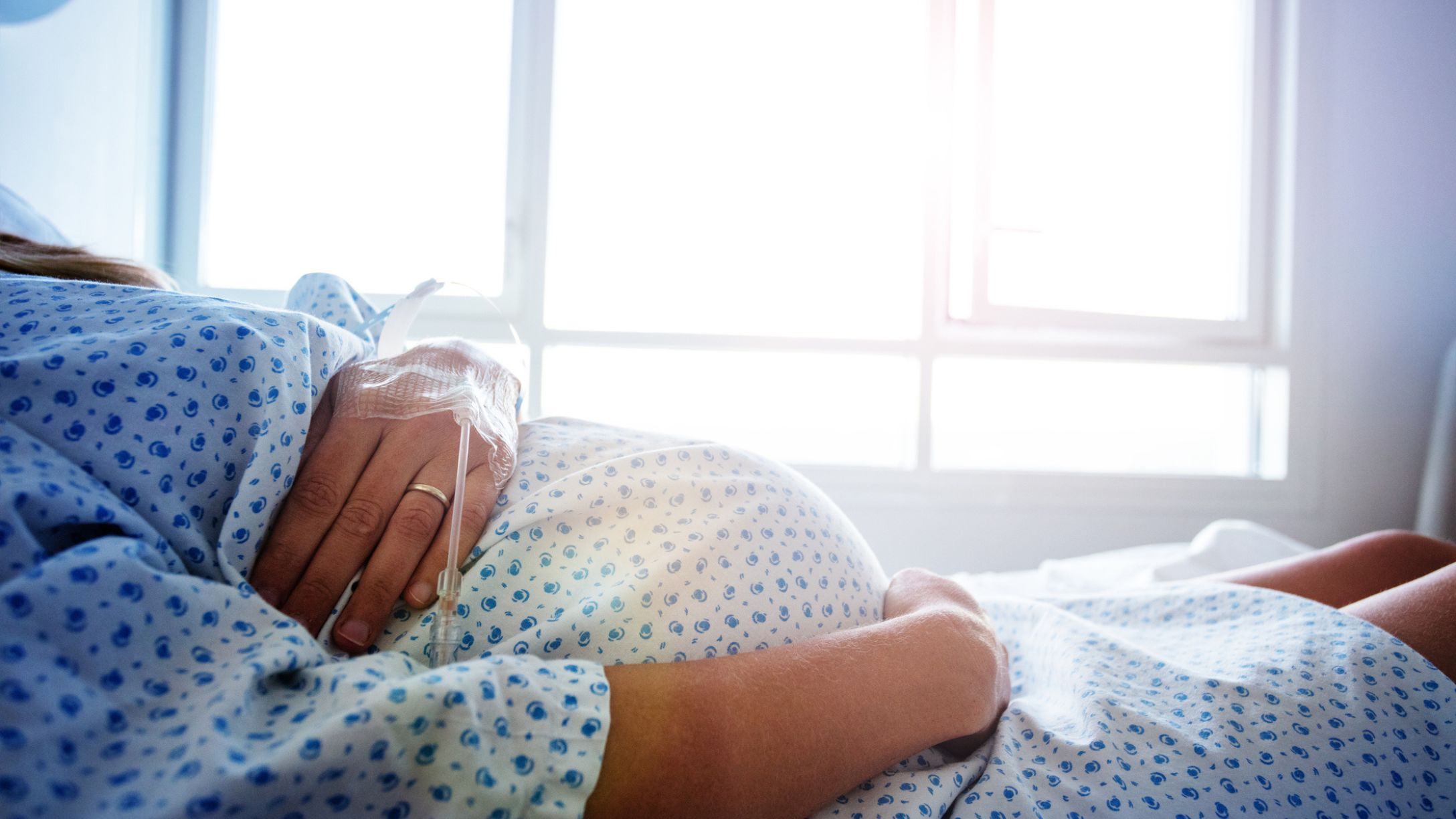 Close-up of a pregnant woman's stomach in the hospital