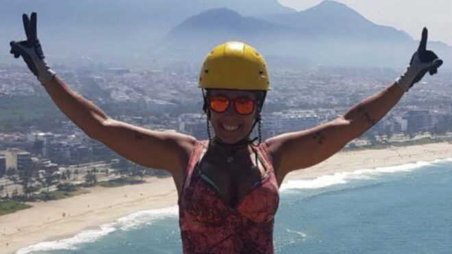 Rosemary Suzart Garcia standing near a cliff in safety gear