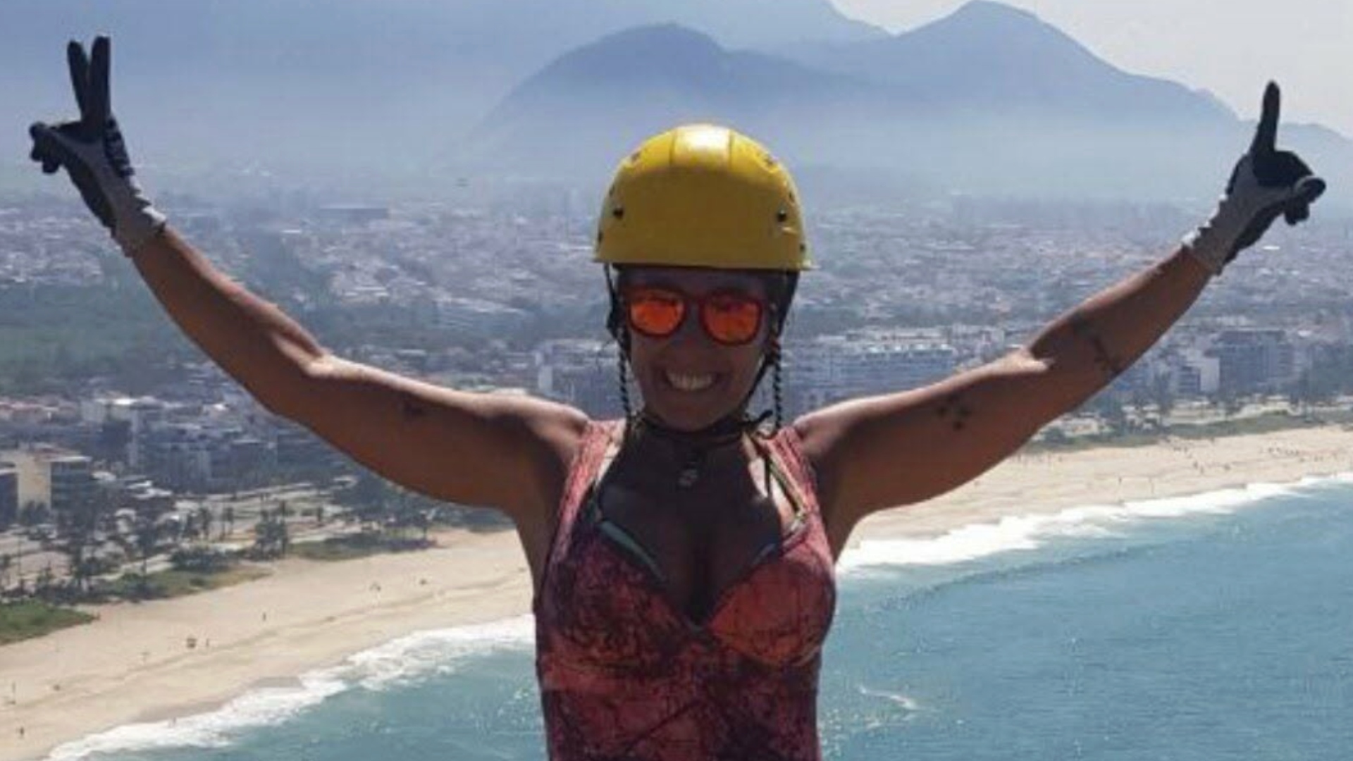 Rosemary Suzart Garcia standing near a cliff in safety gear