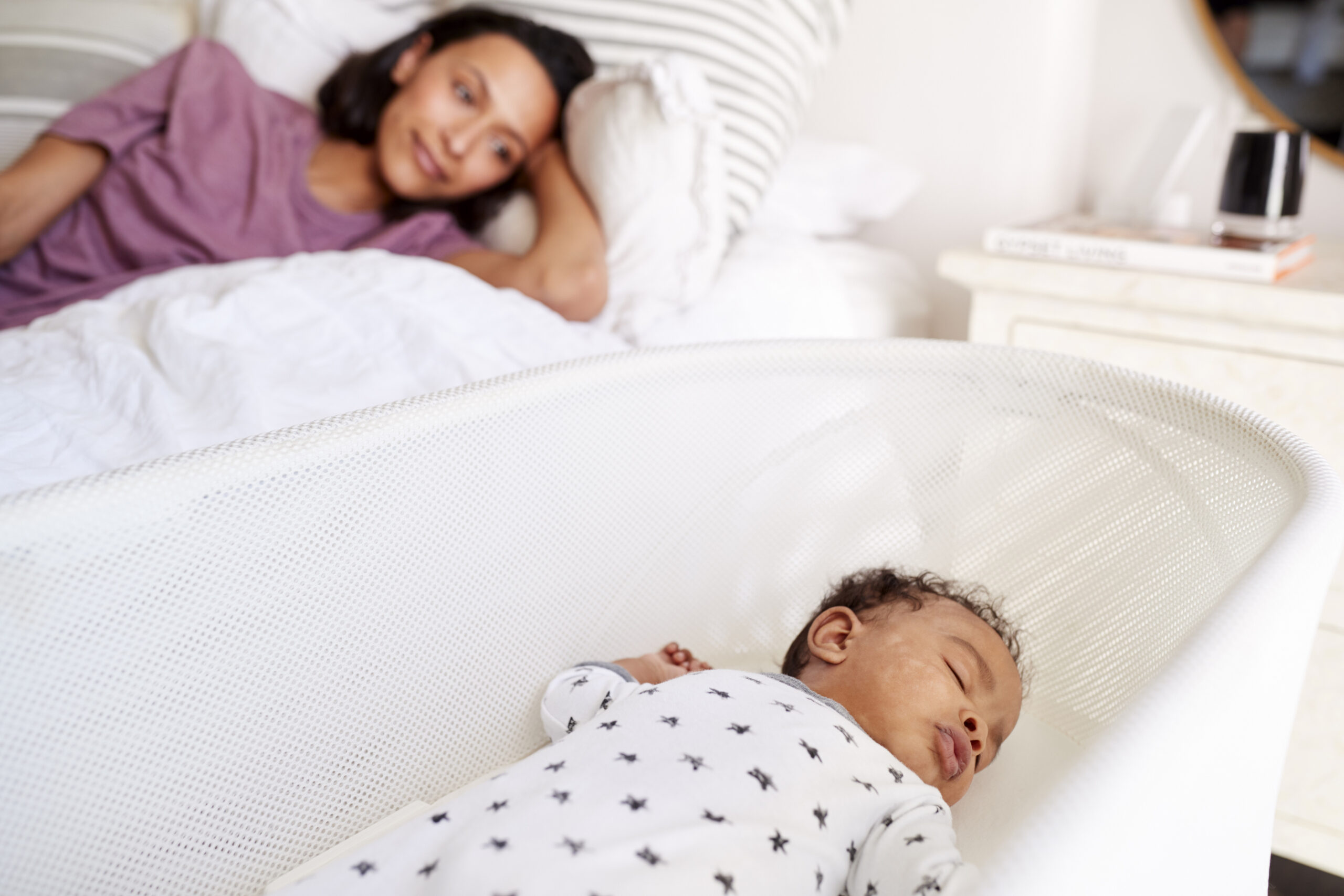 mom watching sleeping baby