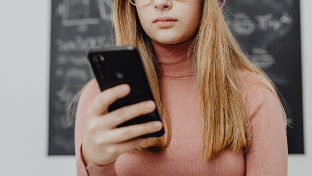 young woman looking at phone
