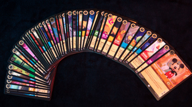 A selection of cards from one of the first starter decks from the Disney-themed card game "Lorcana," a new title from tabletop game company Ravensburger